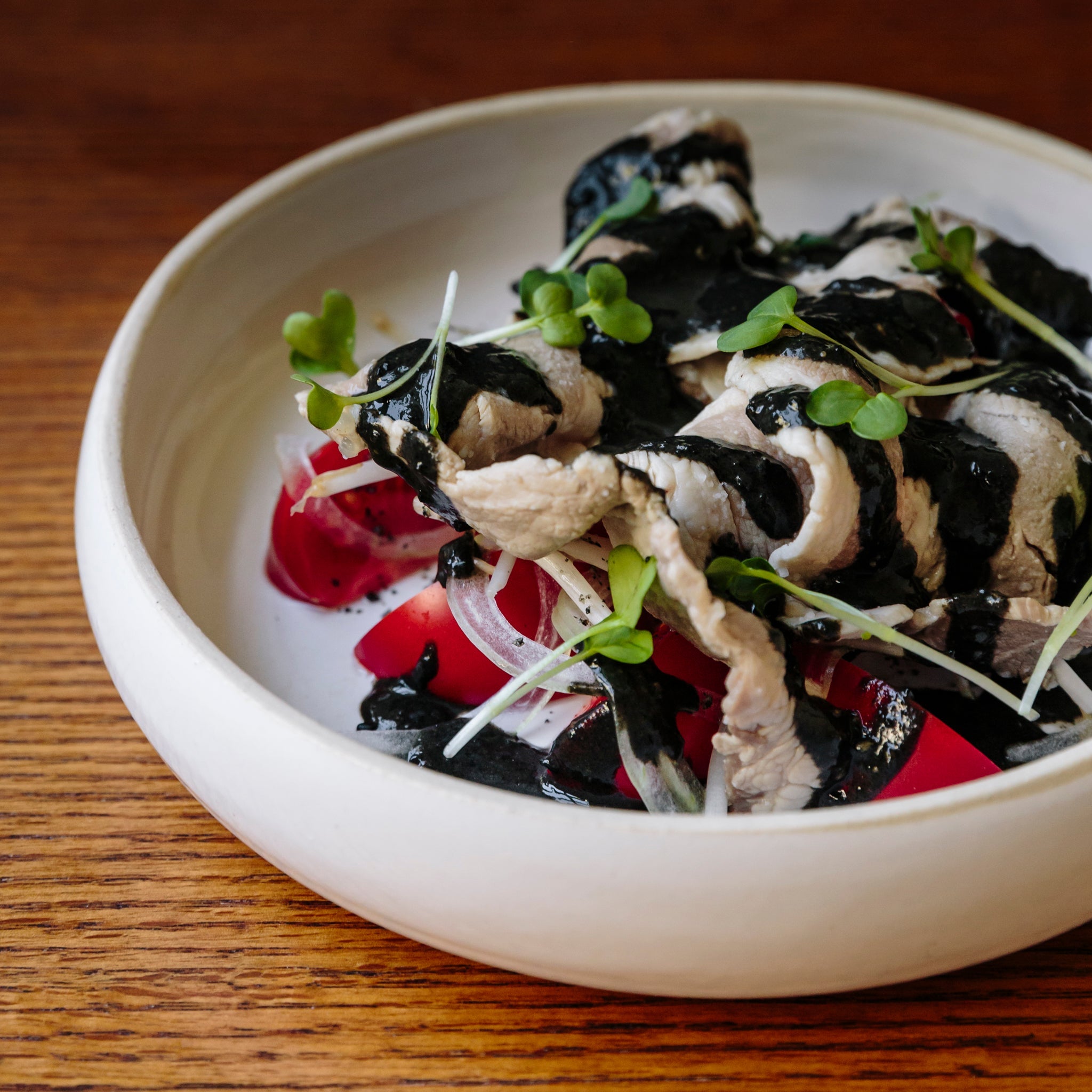 Pork Shabu-Shabu Salad, Heirloom Tomatoes, Onion & Black Sesame